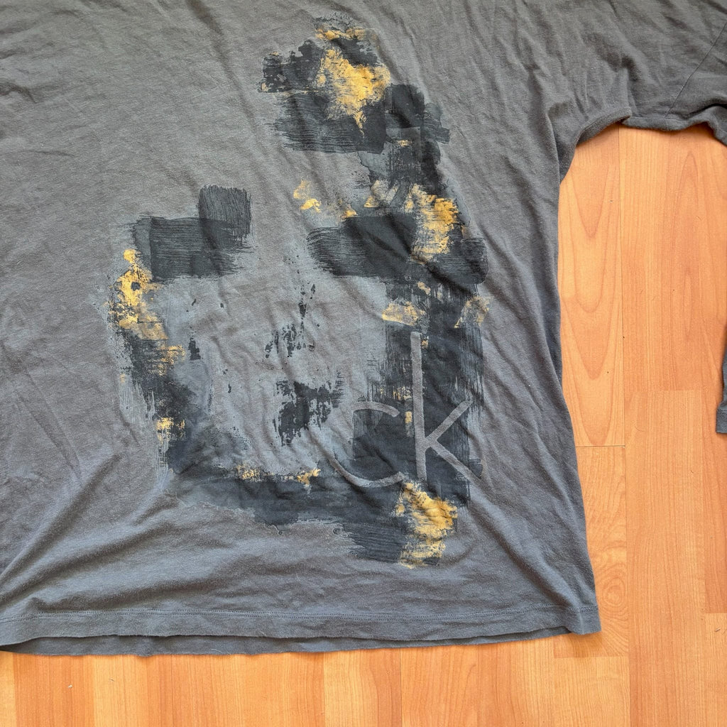 Calvin Klein grey long sleeve T-shirt large with faded 'ck' graphic print and round neckline.