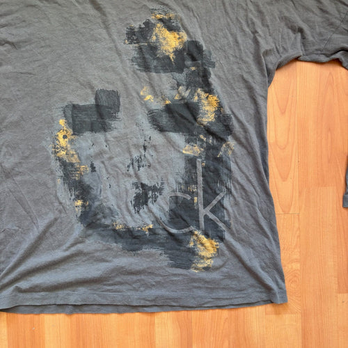Calvin Klein grey long sleeve T-shirt large with faded 'ck' graphic print and round neckline.