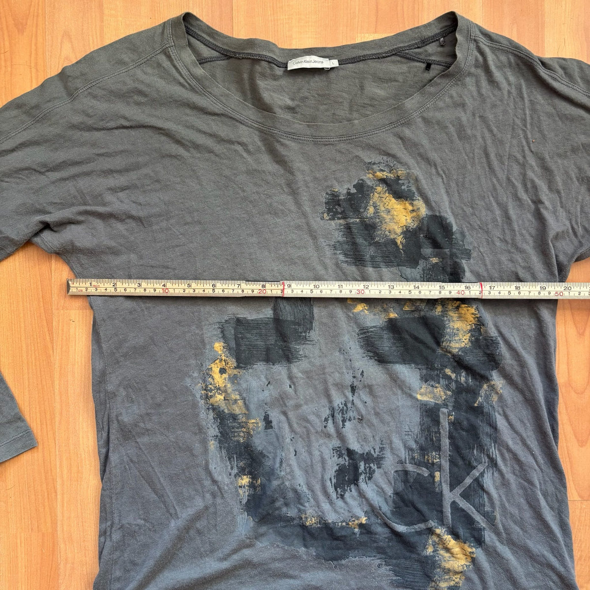 Calvin Klein grey long sleeve T-shirt large with faded 'ck' graphic print and round neckline.