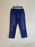 Workwear blue moleskin trousers with snap-button fly and utility pockets, vintage style.