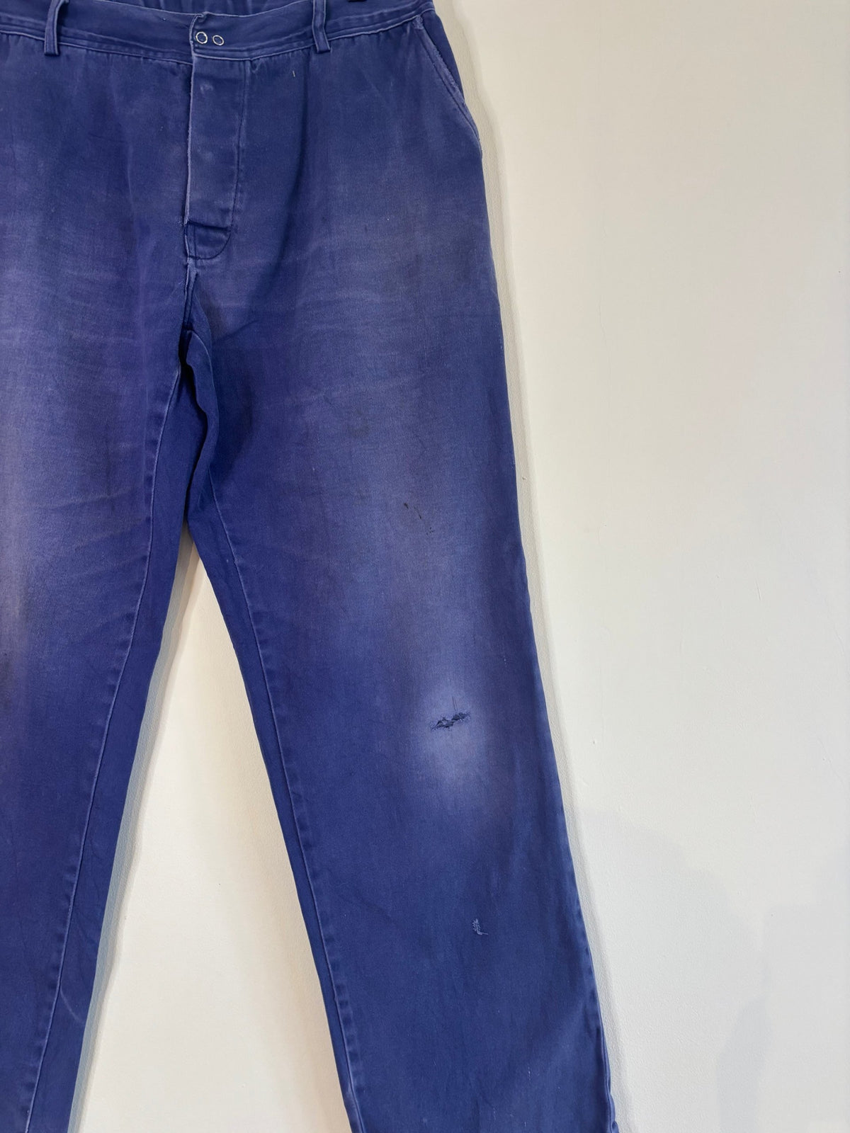 Workwear blue moleskin trousers with snap-button fly and utility pockets, vintage style.