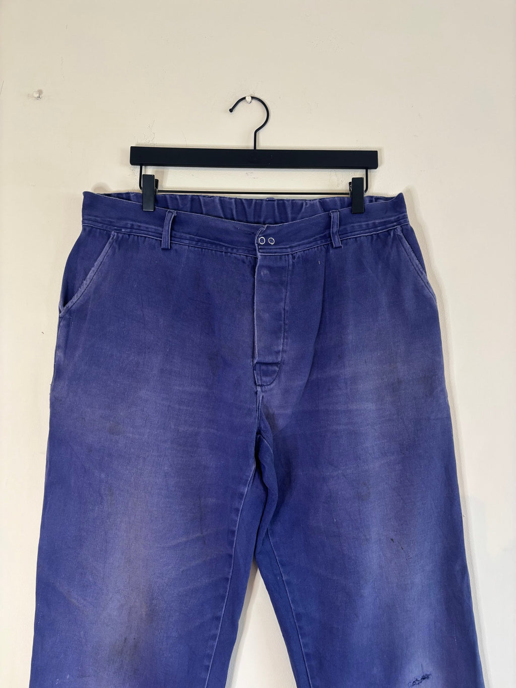 Workwear blue moleskin trousers with snap-button fly and utility pockets, vintage style.