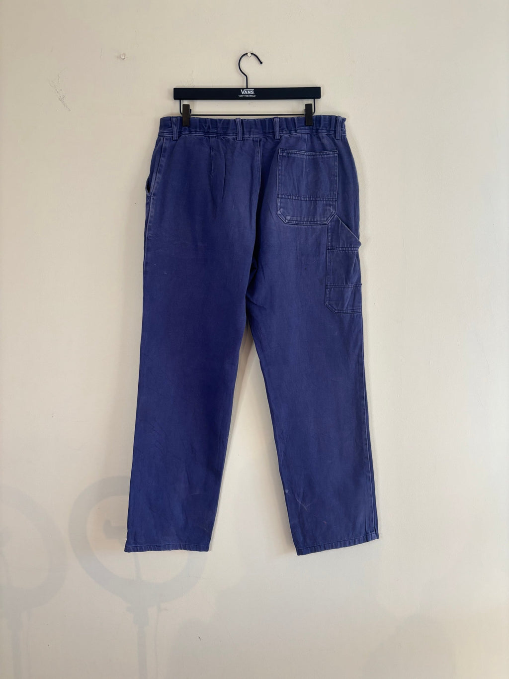 Workwear blue moleskin trousers with snap-button fly and utility pockets, vintage style.