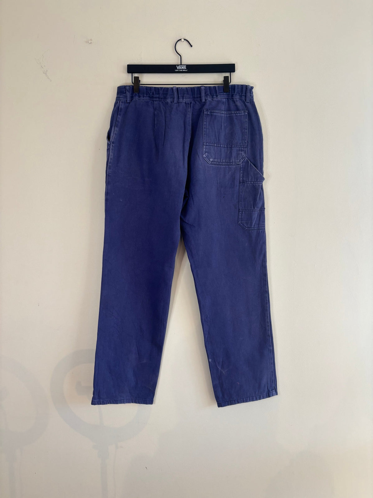 Workwear blue moleskin trousers with snap-button fly and utility pockets, vintage style.