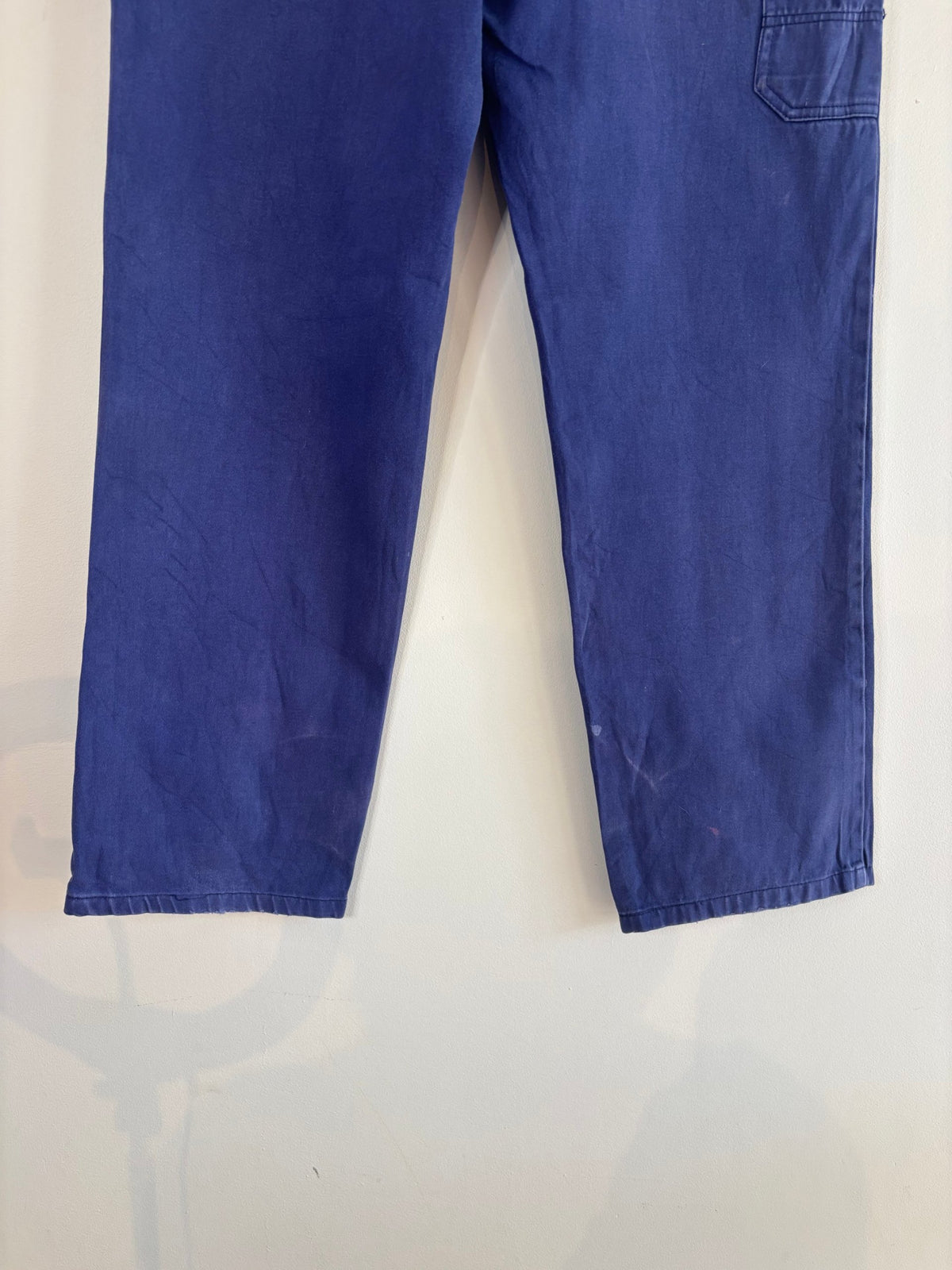 Workwear blue moleskin trousers with snap-button fly and utility pockets, vintage style.