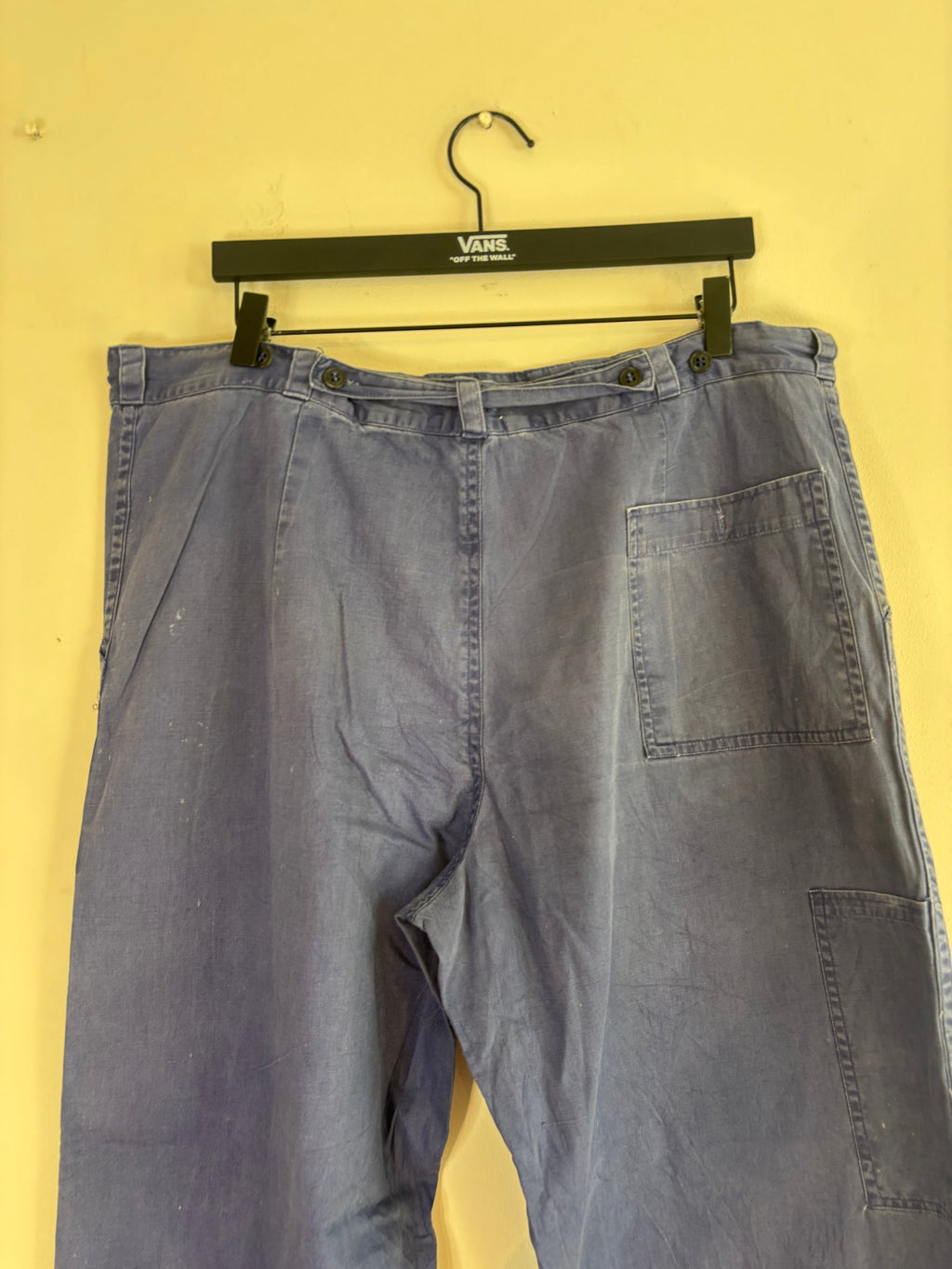Vintage blue cotton twill pants with double-knee panels and adjustable back-buckle cinch.