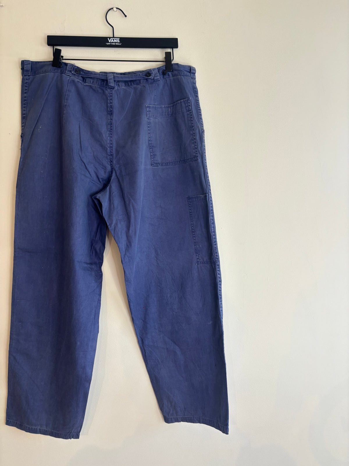 Vintage blue cotton twill pants with double-knee panels and adjustable back-buckle cinch.