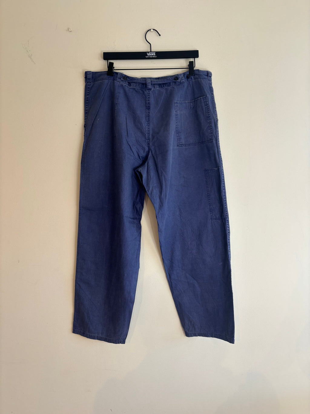 Vintage blue cotton twill pants with double-knee panels and adjustable back-buckle cinch.