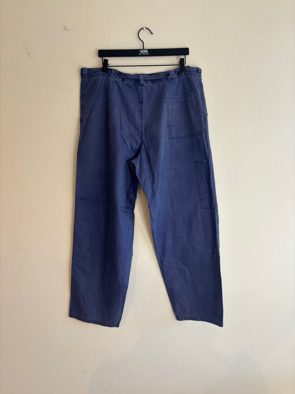 Vintage blue cotton twill pants with double-knee panels and adjustable back-buckle cinch.