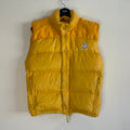 Moncler yellow down gilet vest with snap-button placket and zip pockets, made in France.