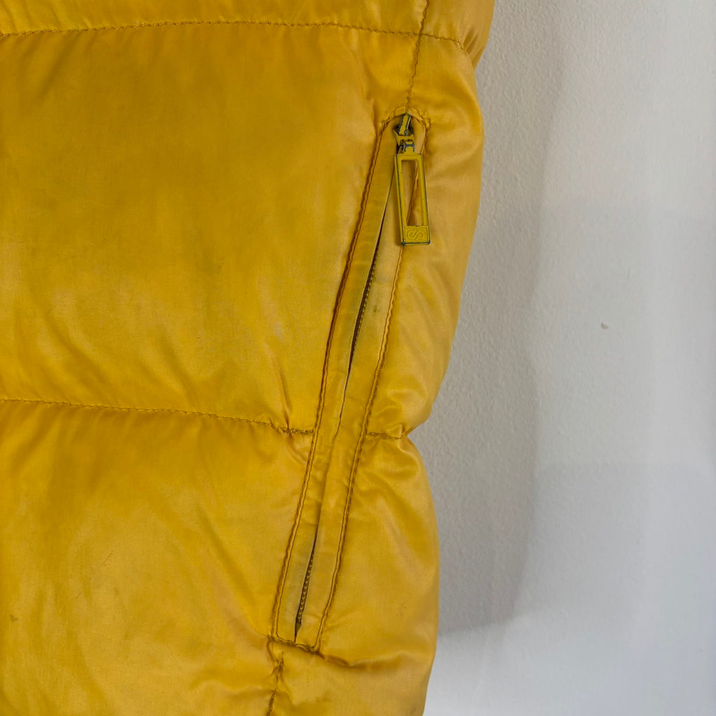 Moncler yellow down gilet vest with snap-button placket and zip pockets, made in France.