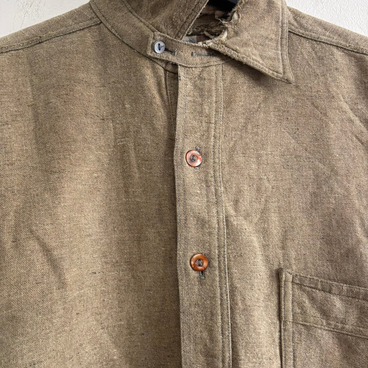Selecto olive green pullover work shirt with distressed fabric, half-button placket, and chest pocket.