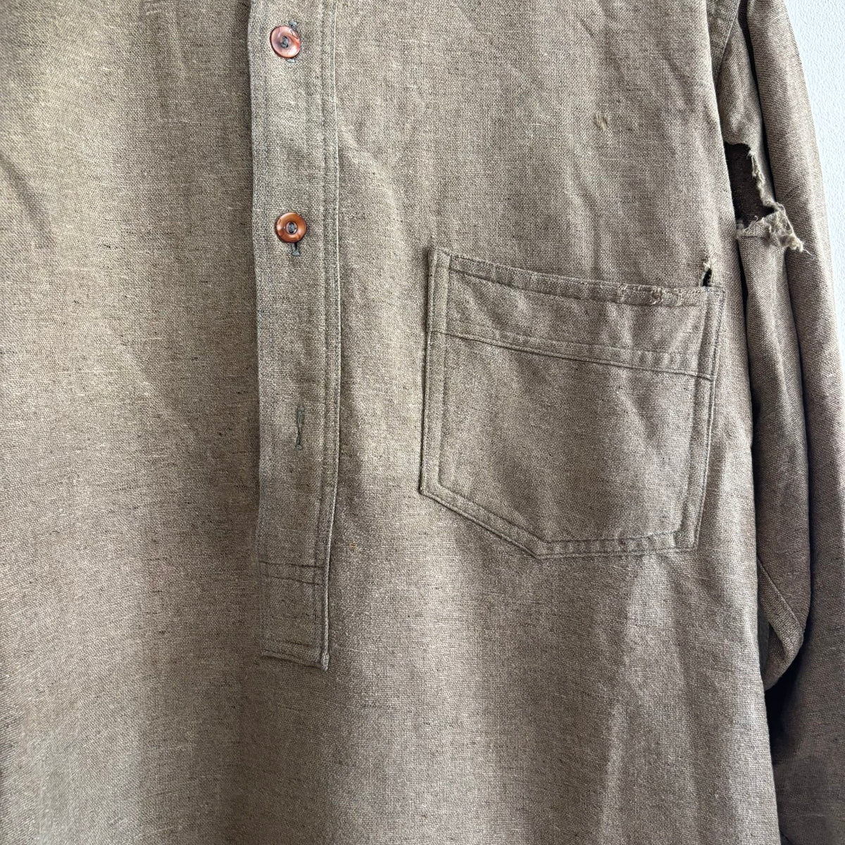 Selecto olive green pullover work shirt with distressed fabric, half-button placket, and chest pocket.