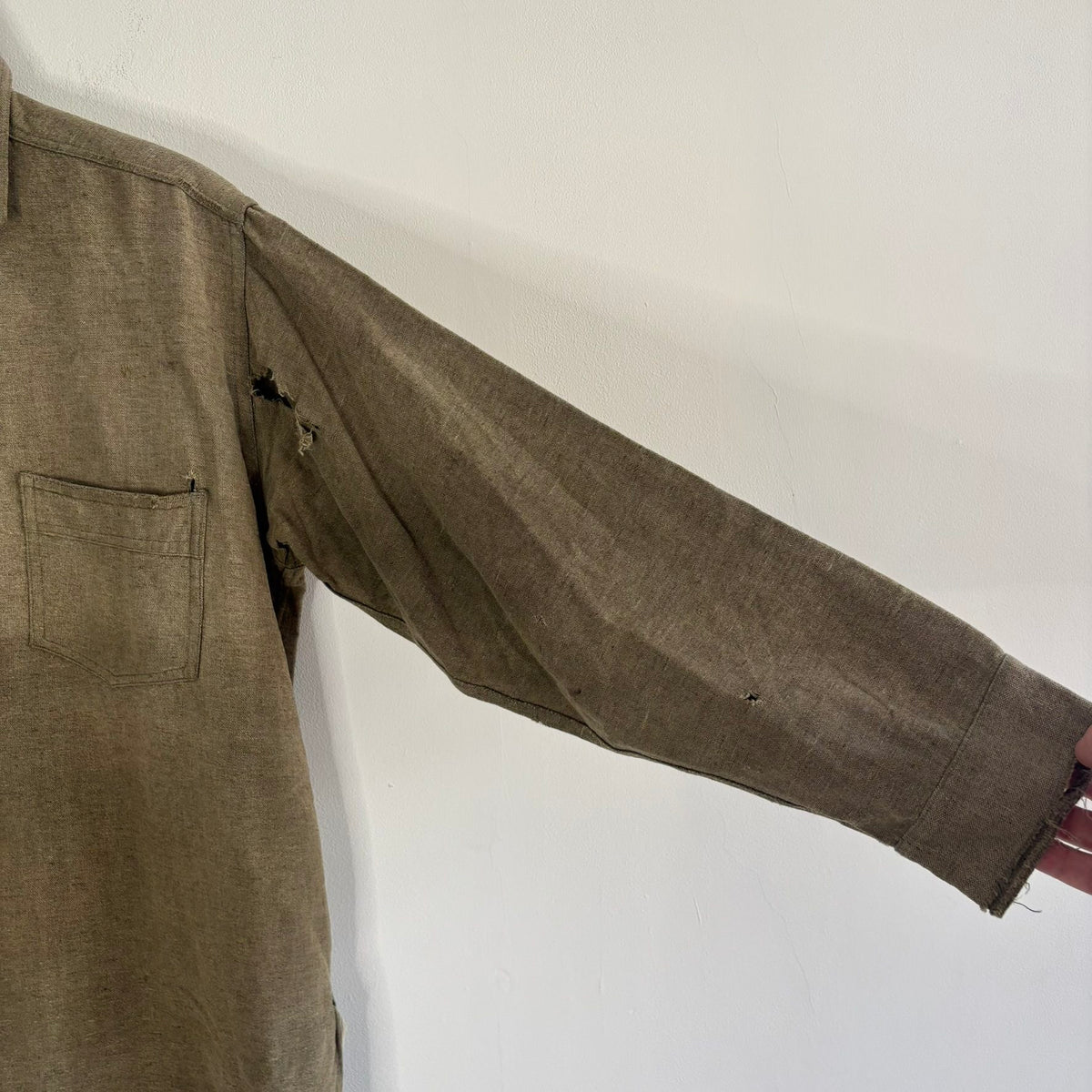 Selecto olive green pullover work shirt with distressed fabric, half-button placket, and chest pocket.