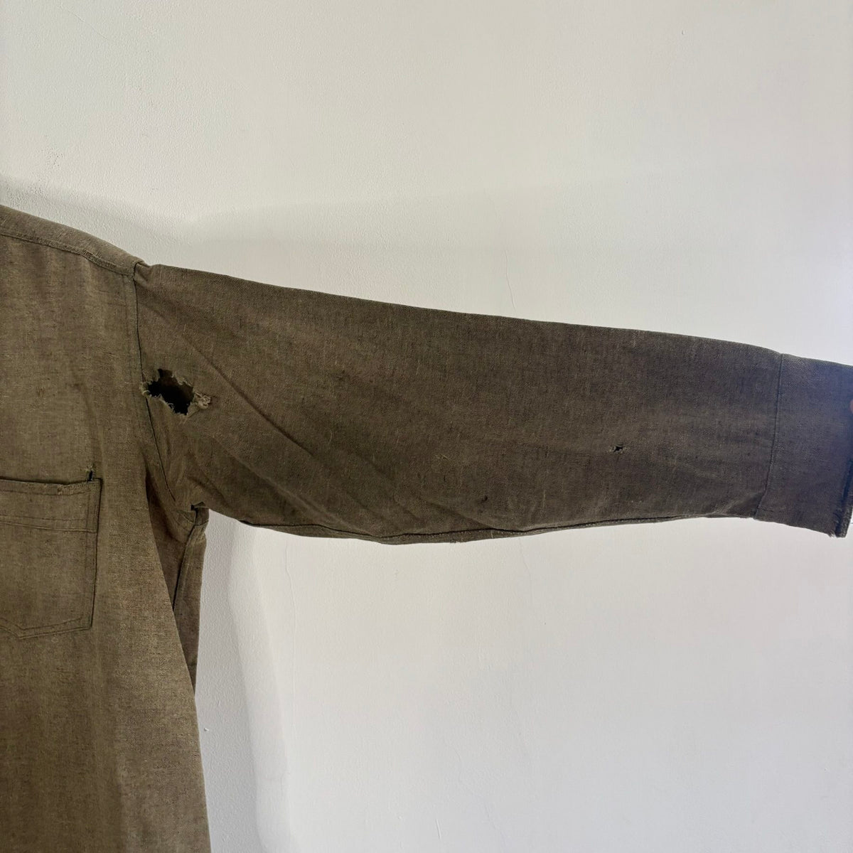 Selecto olive green pullover work shirt with distressed fabric, half-button placket, and chest pocket.