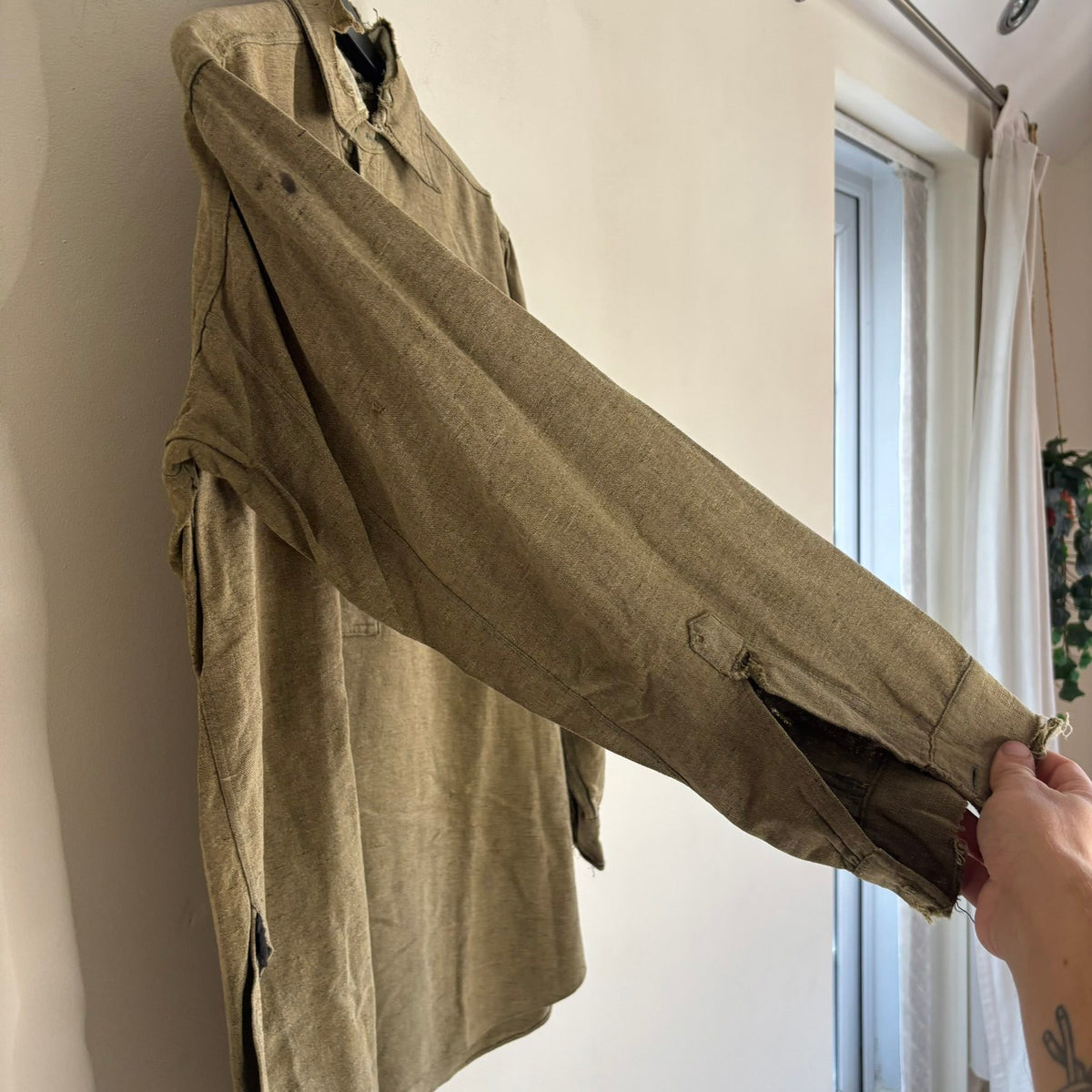 Selecto olive green pullover work shirt with distressed fabric, half-button placket, and chest pocket.