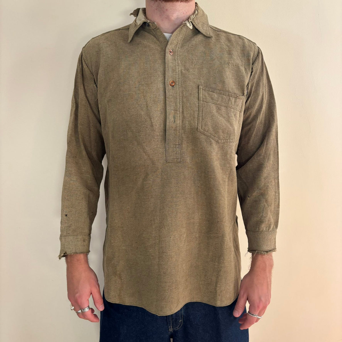 Selecto olive green pullover work shirt with distressed fabric, half-button placket, and chest pocket.
