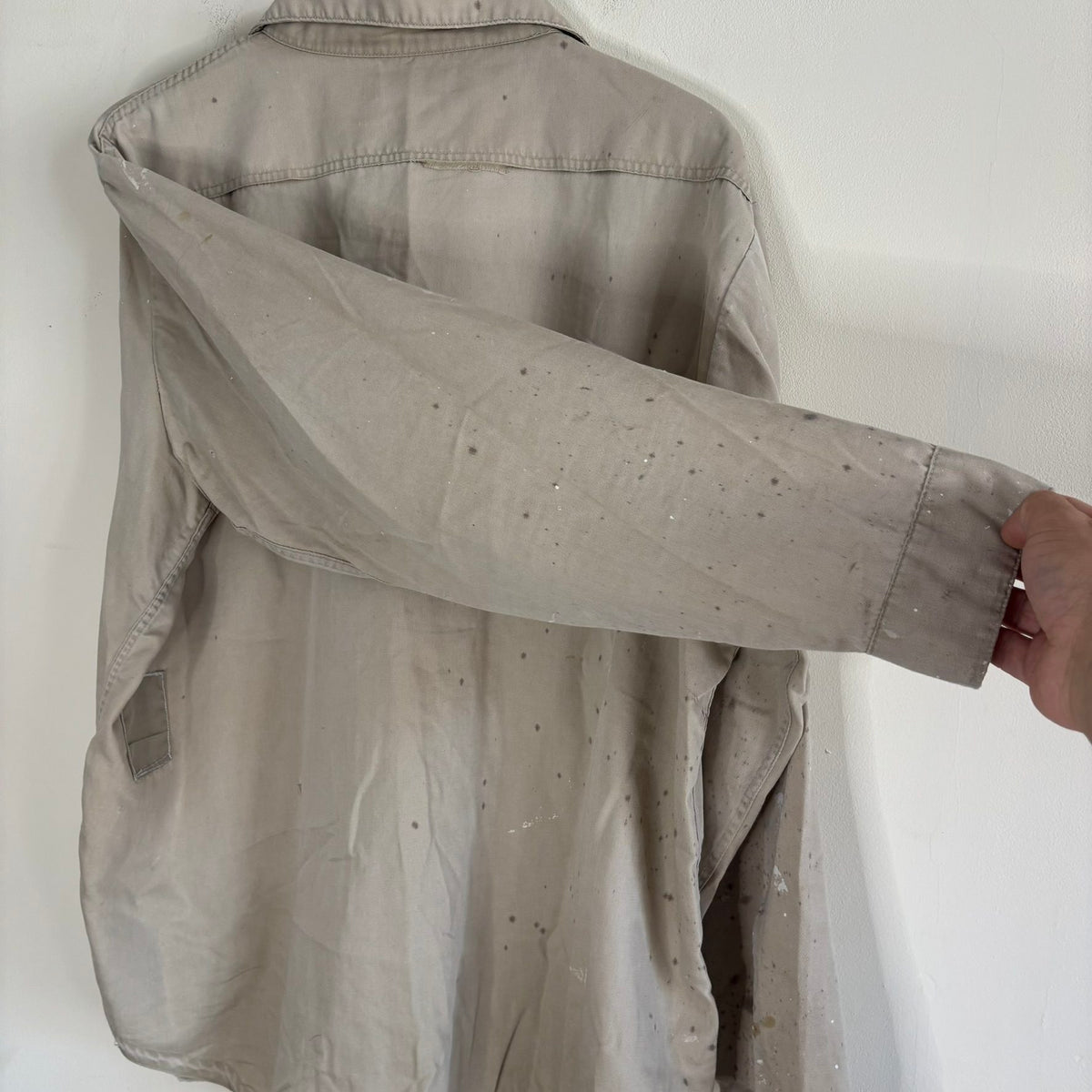 Sears beige long sleeve overshirt with paint splatter and two chest flap pockets.