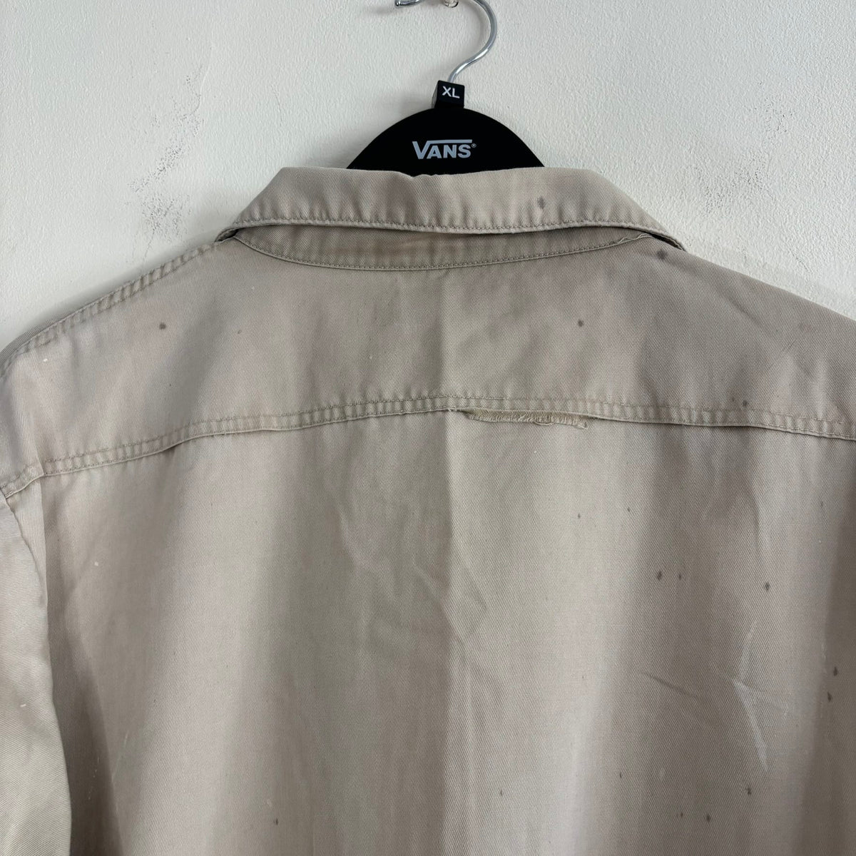 Sears beige long sleeve overshirt with paint splatter and two chest flap pockets.