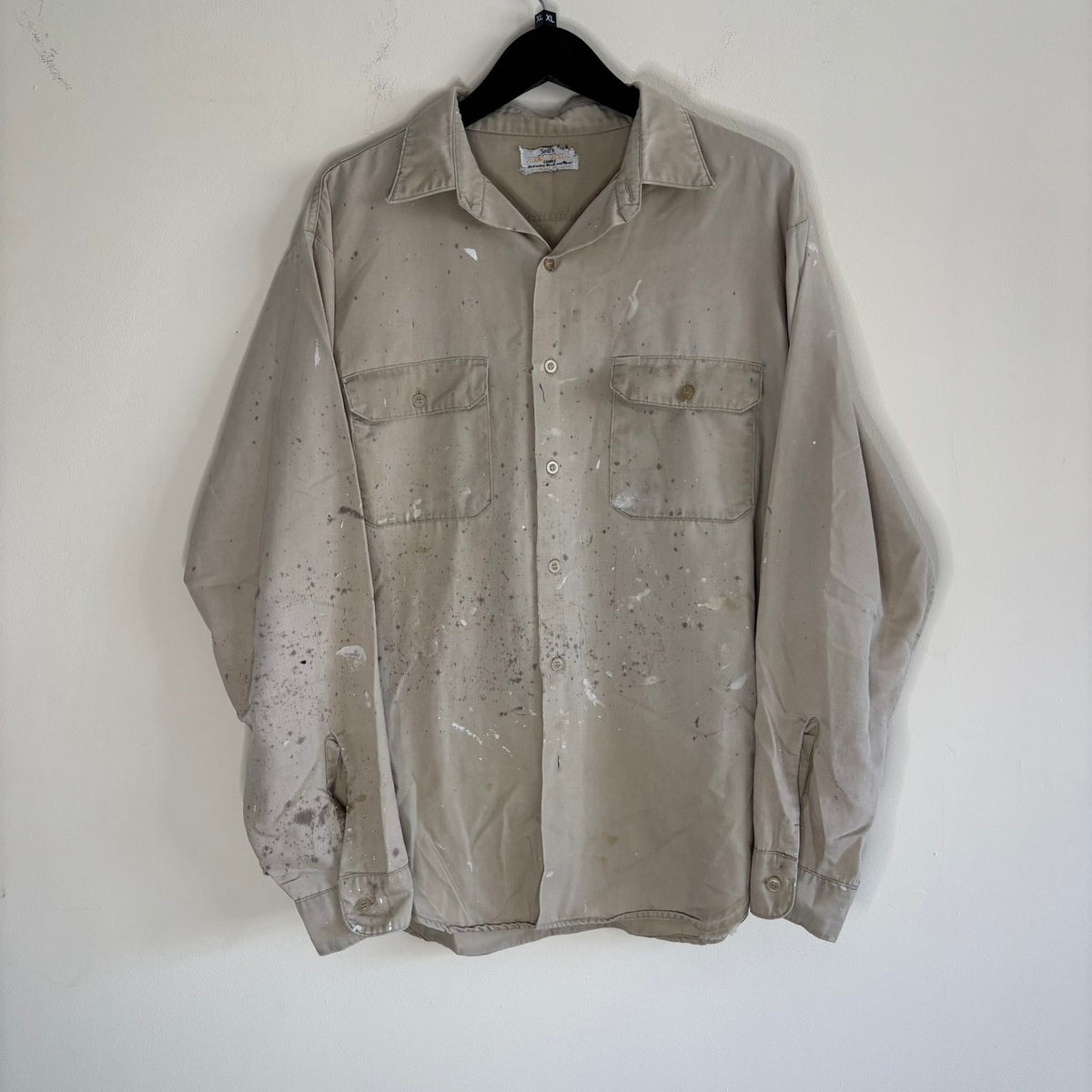 Sears beige long sleeve overshirt with paint splatter and two chest flap pockets.