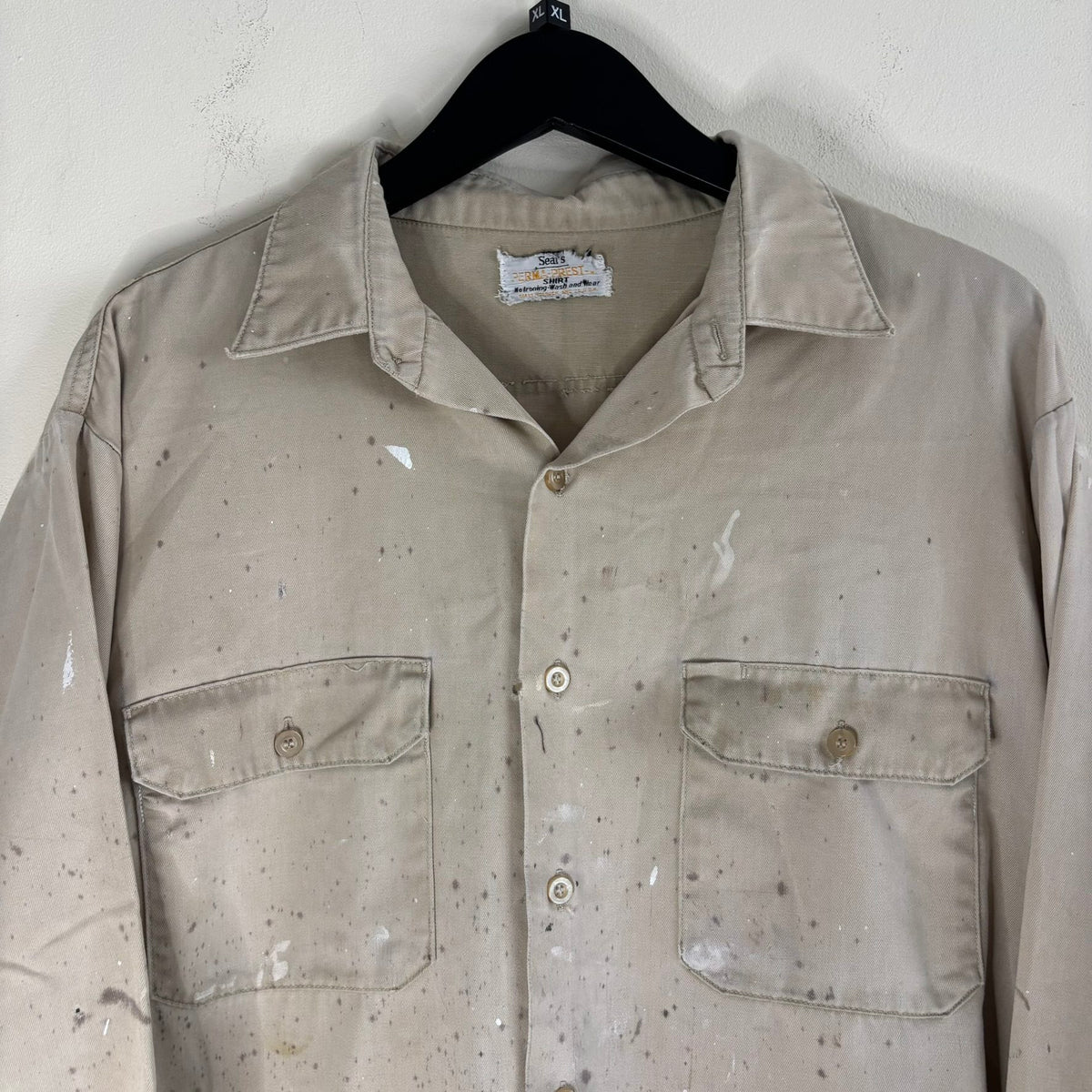 Sears beige long sleeve overshirt with paint splatter and two chest flap pockets.