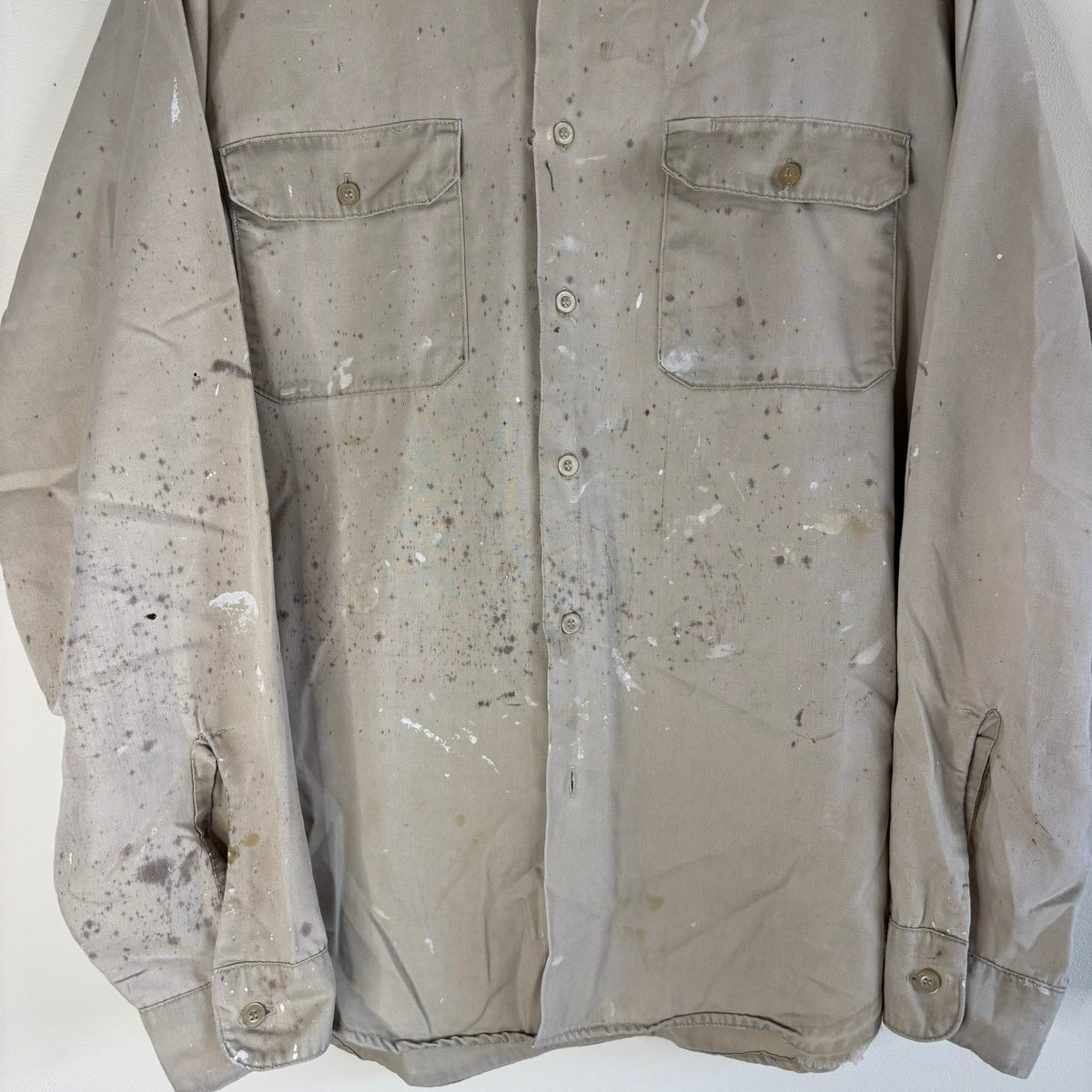 Sears beige long sleeve overshirt with paint splatter and two chest flap pockets.