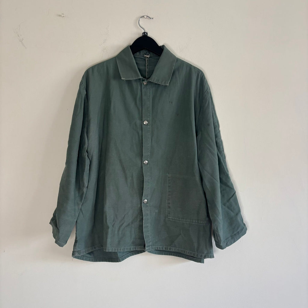Vintage green cotton work jacket with snap front and stencilled "McLOUTH" on back.