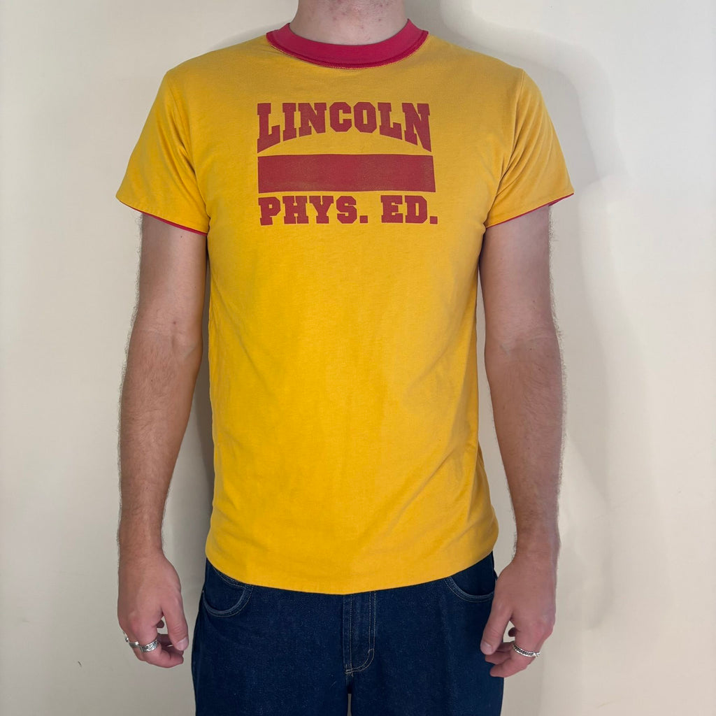 Vintage 70s Lincoln Phys Ed reversible shirt red yellow crew neck with contrasting print.