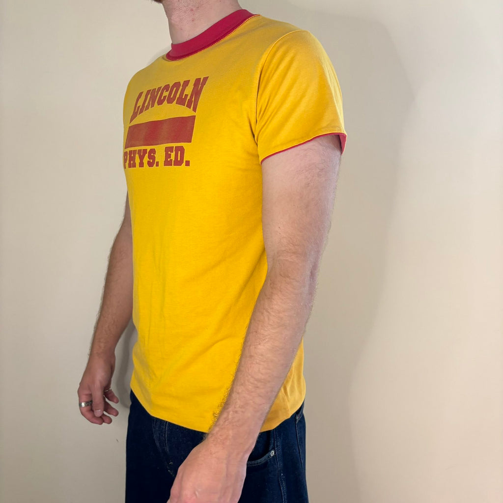 Vintage 70s Lincoln Phys Ed reversible shirt red yellow crew neck with contrasting print.