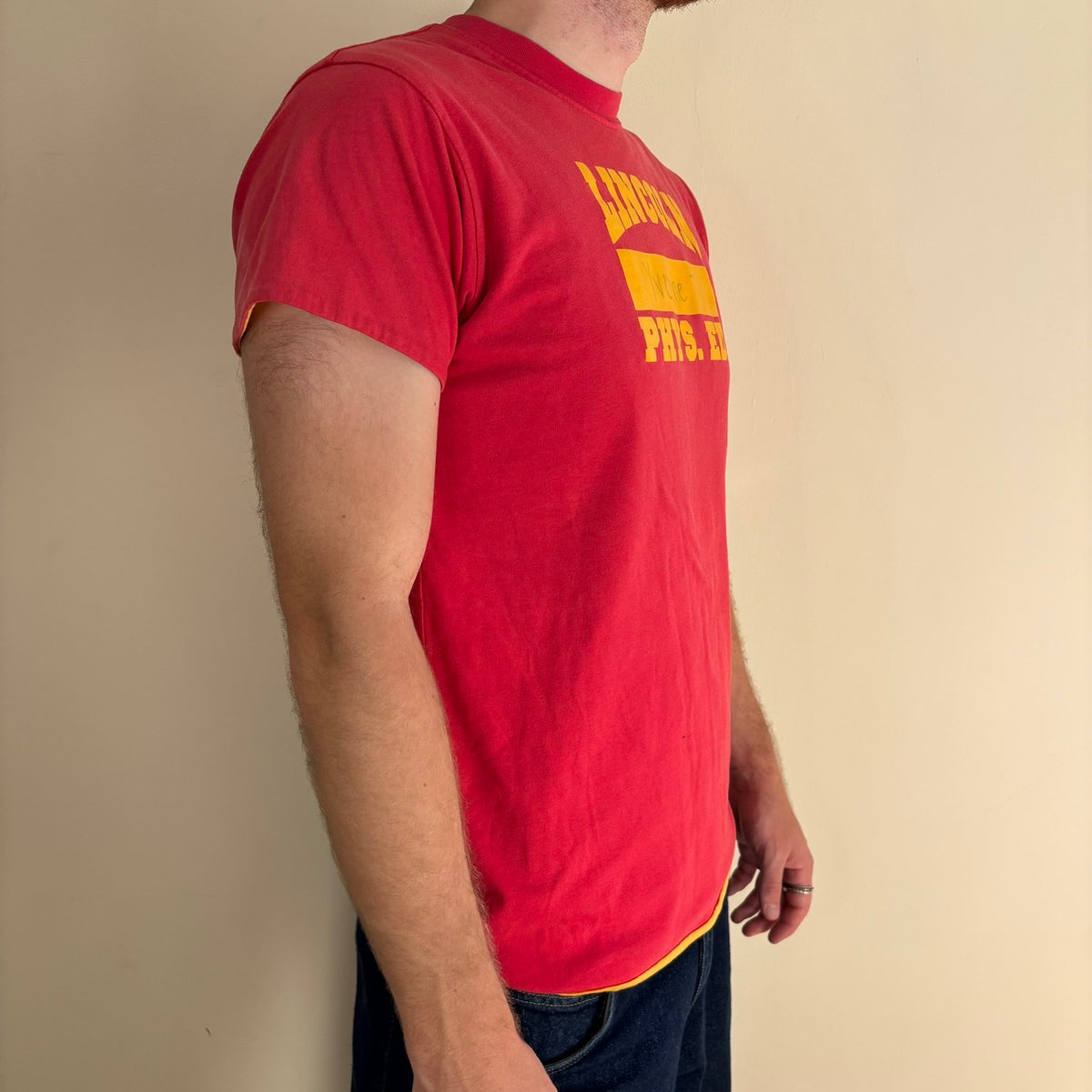 Vintage 70s Lincoln Phys Ed reversible shirt red yellow crew neck with contrasting print.