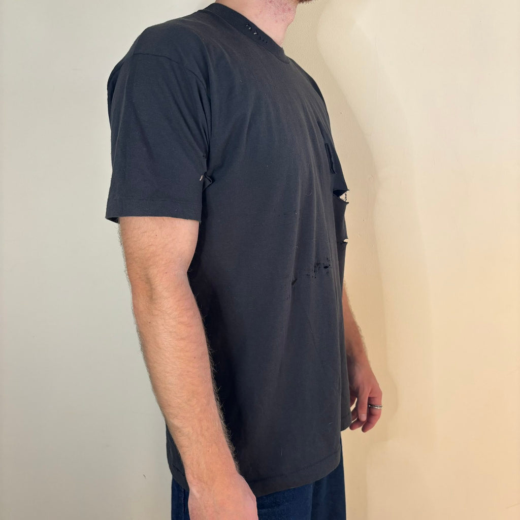 Vintage black band t-shirt single-stitch with ghost pocket detail and faded charcoal color.