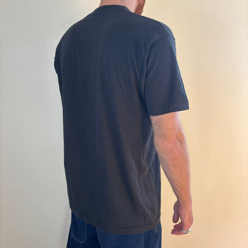 Vintage black band t-shirt single-stitch with ghost pocket detail and faded charcoal color.
