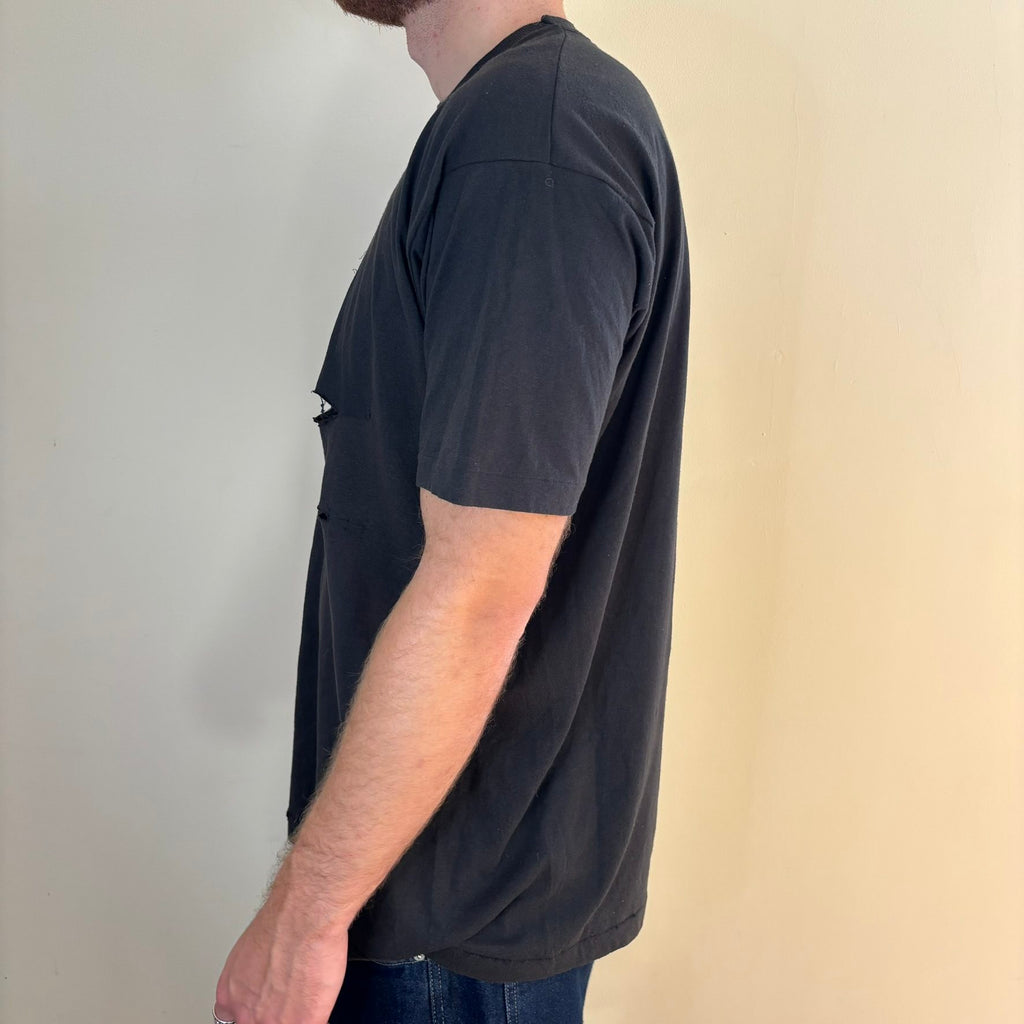Vintage black band t-shirt single-stitch with ghost pocket detail and faded charcoal color.