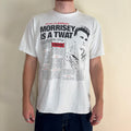 Oneita black graphic tee featuring Morrissey tabloid print and red "EXCLUSIVE" flash.