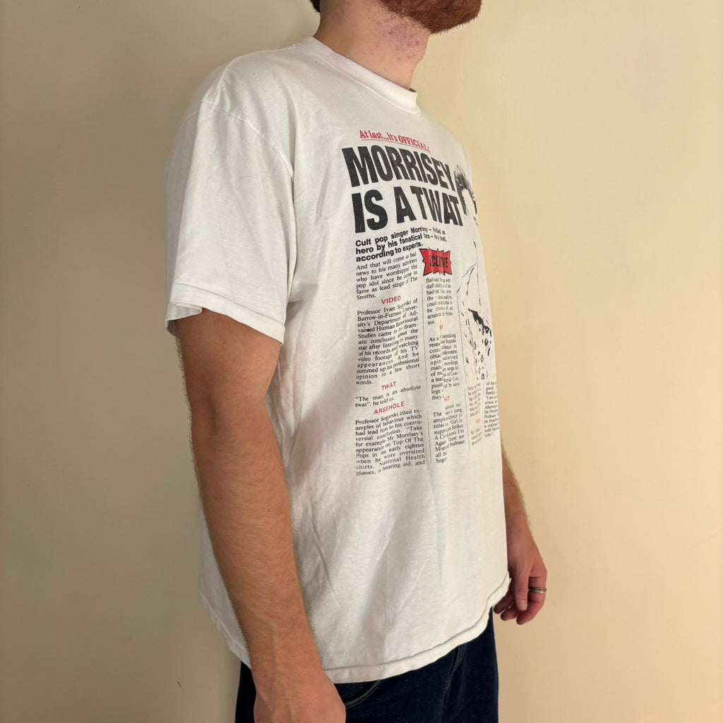 Oneita black graphic tee featuring Morrissey tabloid print and red "EXCLUSIVE" flash.