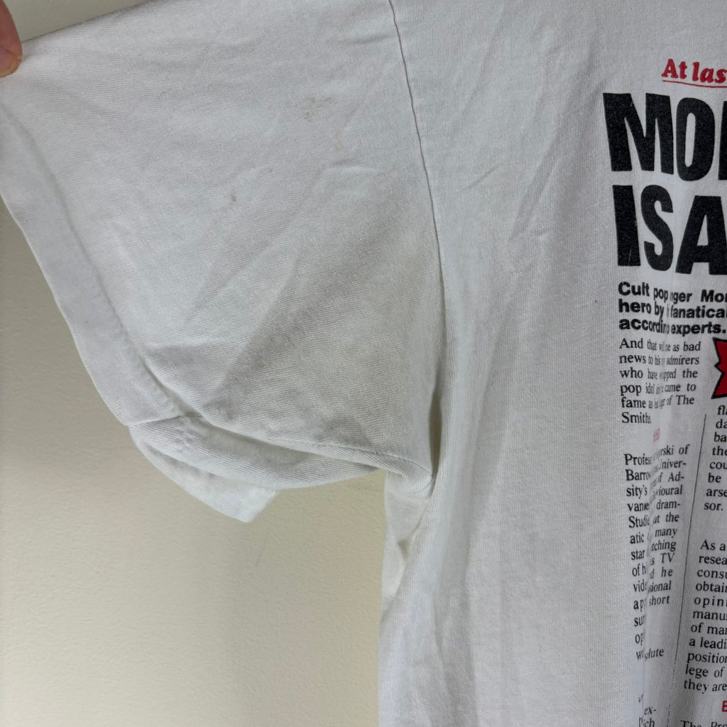 Oneita black graphic tee featuring Morrissey tabloid print and red "EXCLUSIVE" flash.