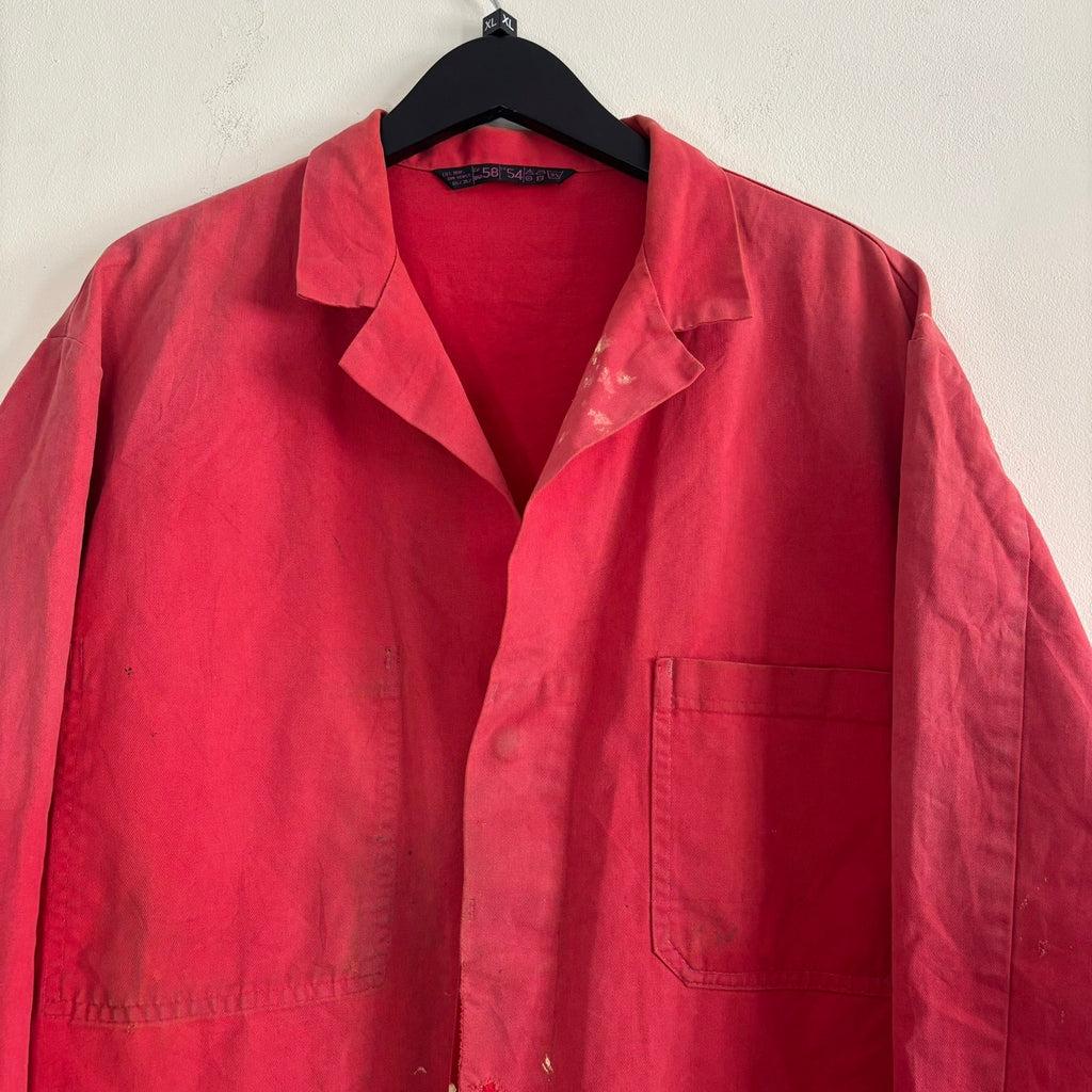 Vintage Euro workwear red chore jacket with faded paint splatters and three-pocket design.