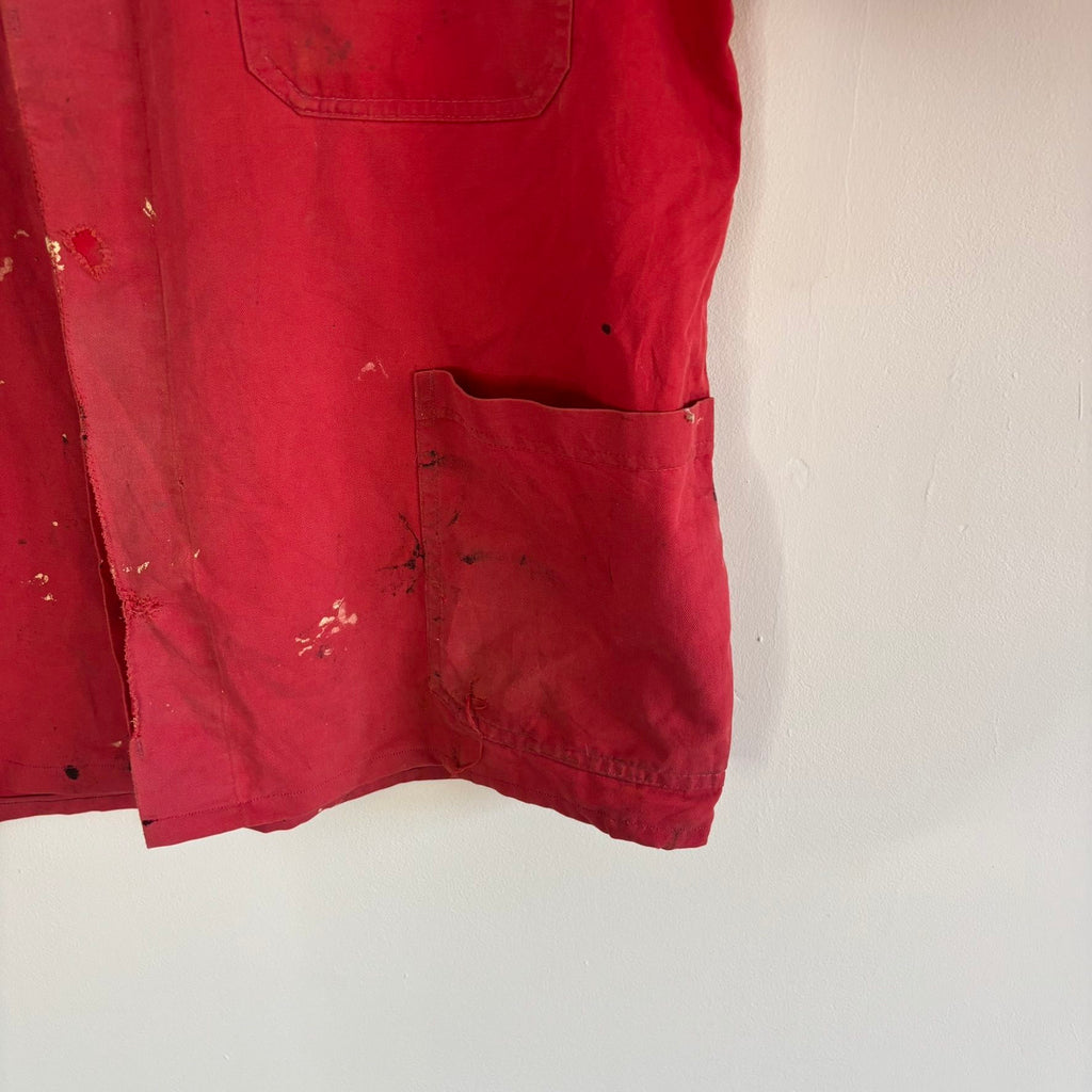 Vintage Euro workwear red chore jacket with faded paint splatters and three-pocket design.