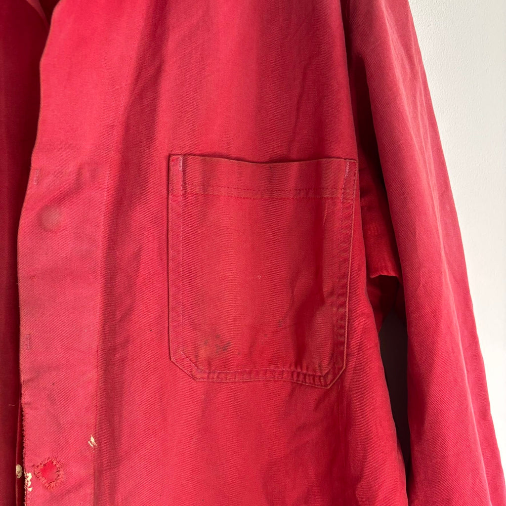 Vintage Euro workwear red chore jacket with faded paint splatters and three-pocket design.