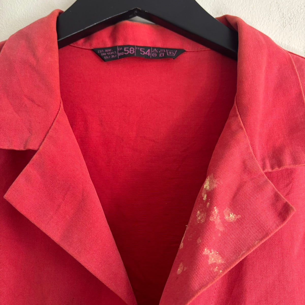 Vintage Euro workwear red chore jacket with faded paint splatters and three-pocket design.