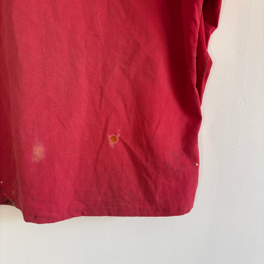 Vintage Euro workwear red chore jacket with faded paint splatters and three-pocket design.