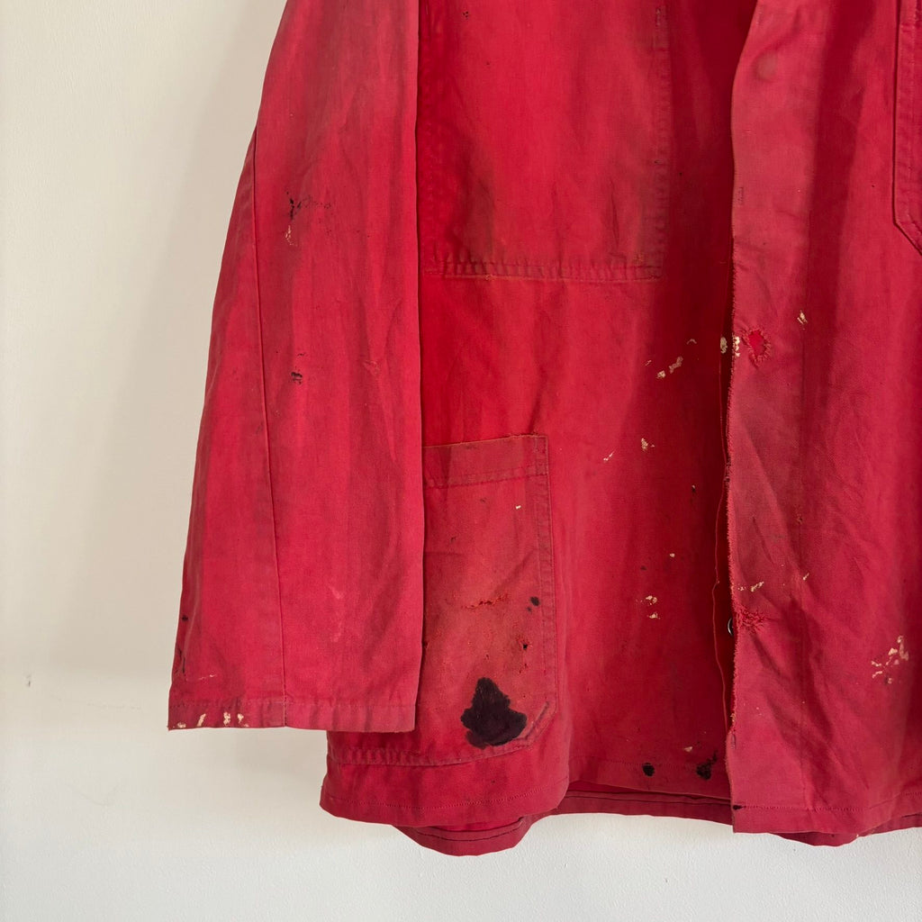 Vintage Euro workwear red chore jacket with faded paint splatters and three-pocket design.