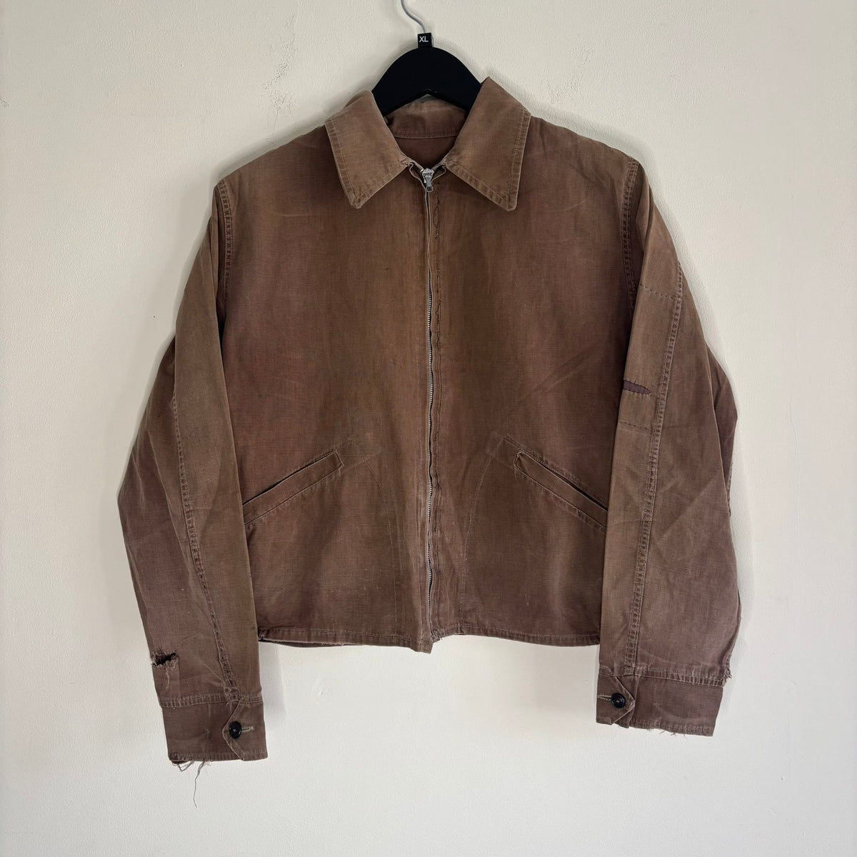Vintage brown cropped work jacket with pointed collar and CROWN zipper pull.