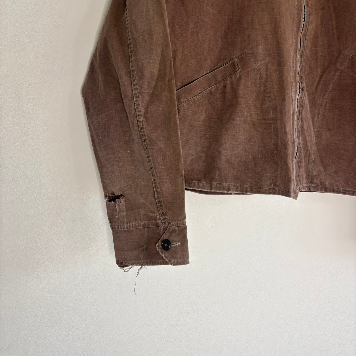 Vintage brown cropped work jacket with pointed collar and CROWN zipper pull.