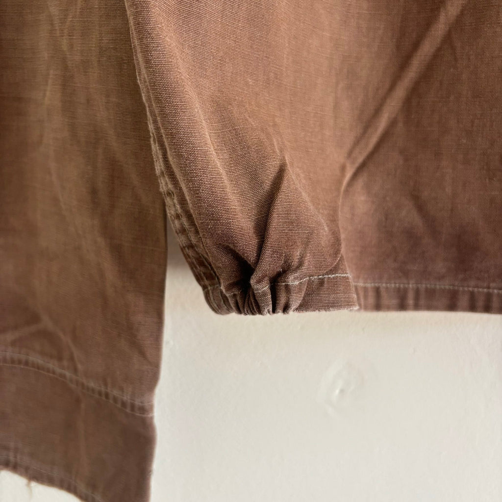 Vintage brown cropped work jacket with pointed collar and CROWN zipper pull.