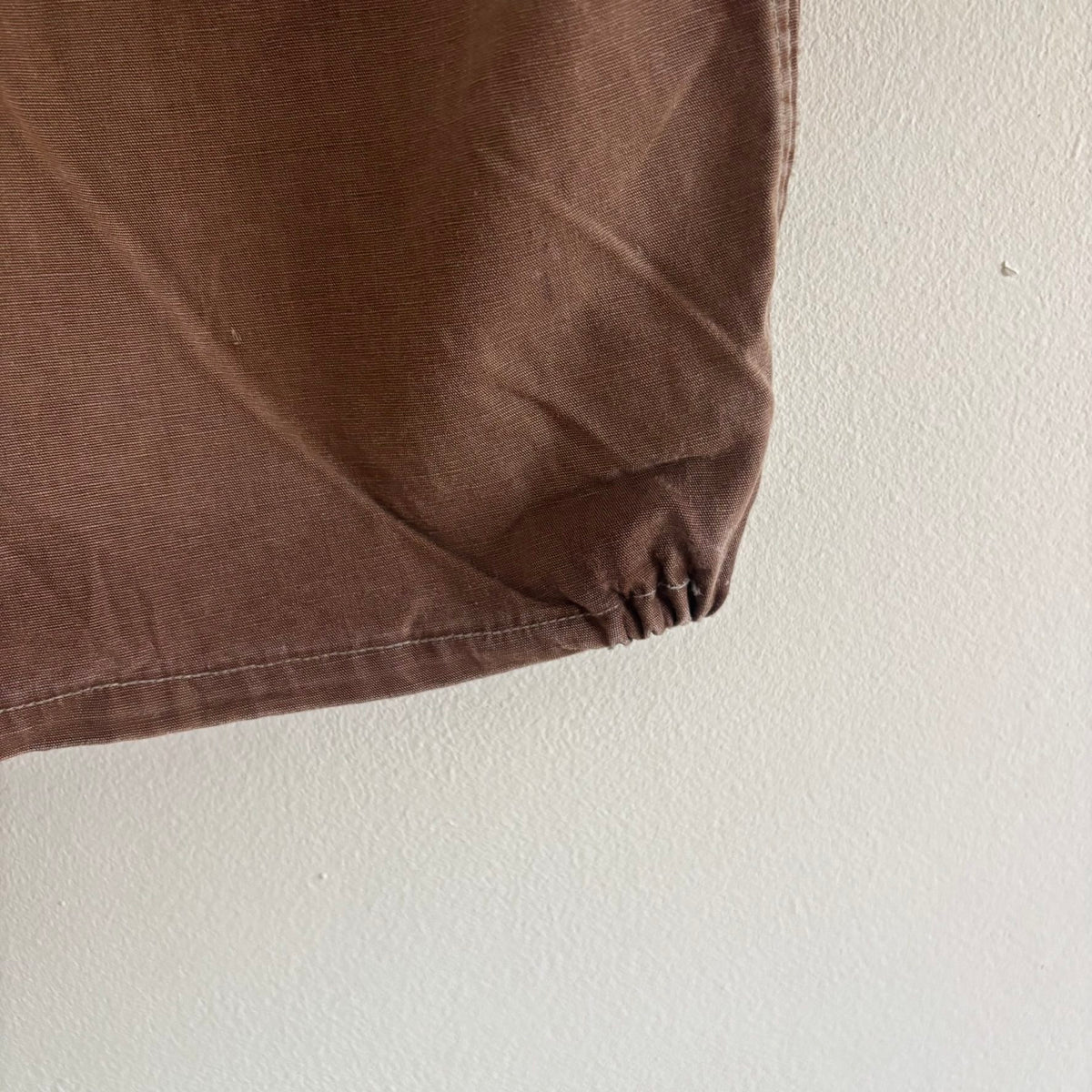 Vintage brown cropped work jacket with pointed collar and CROWN zipper pull.