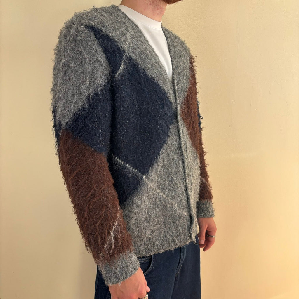 Vintage 70s knitted cardigan grey base with navy and brown oversized argyle pattern.