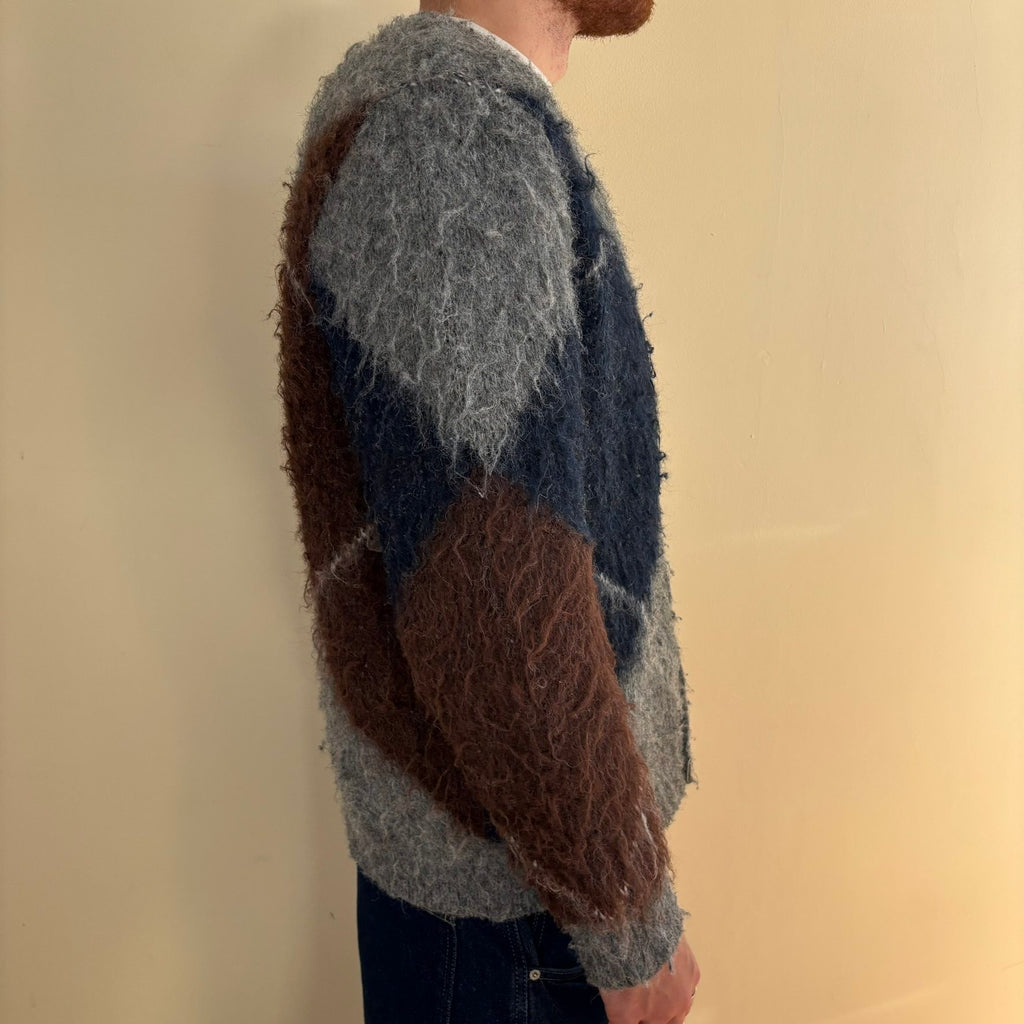 Vintage 70s knitted cardigan grey base with navy and brown oversized argyle pattern.