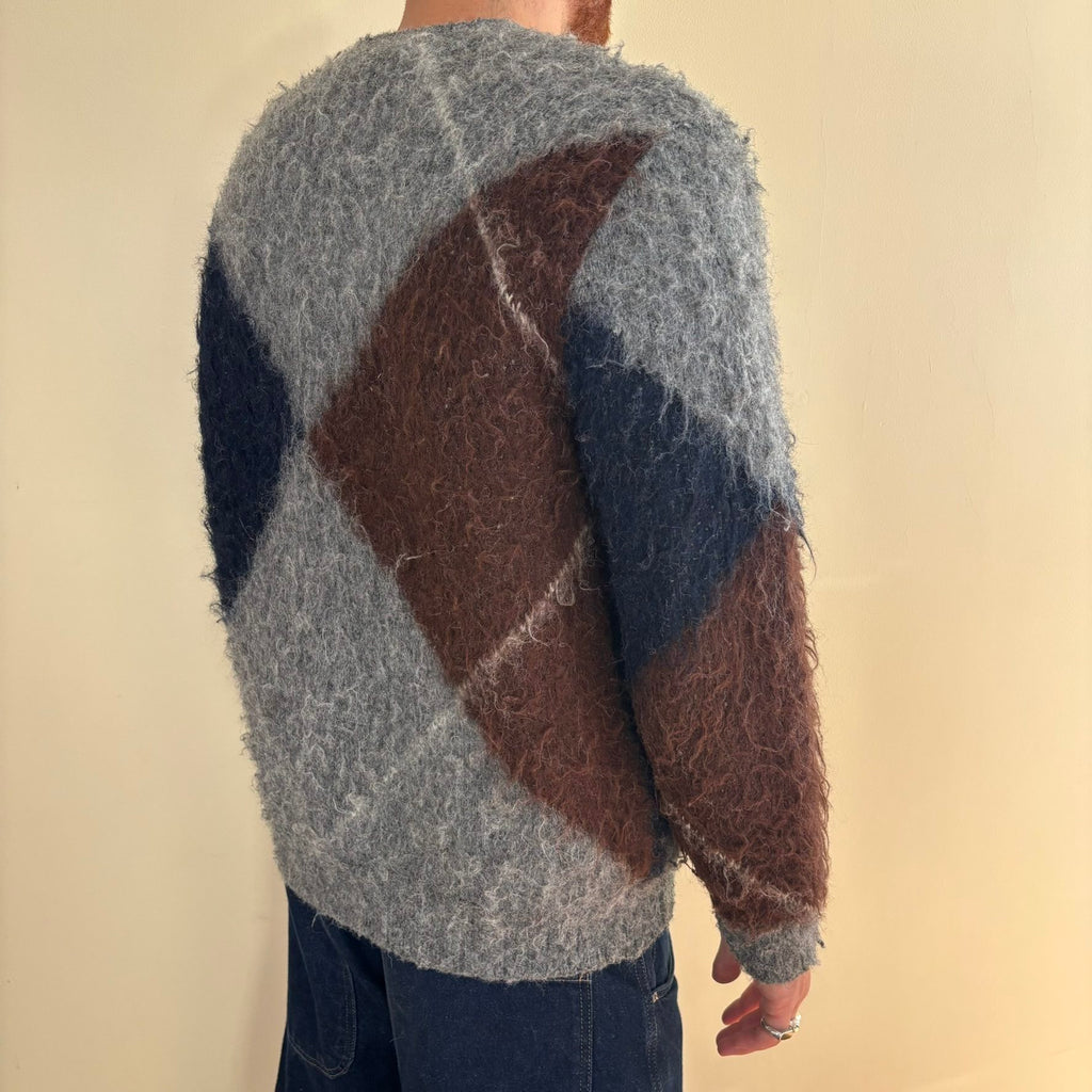 Vintage 70s knitted cardigan grey base with navy and brown oversized argyle pattern.