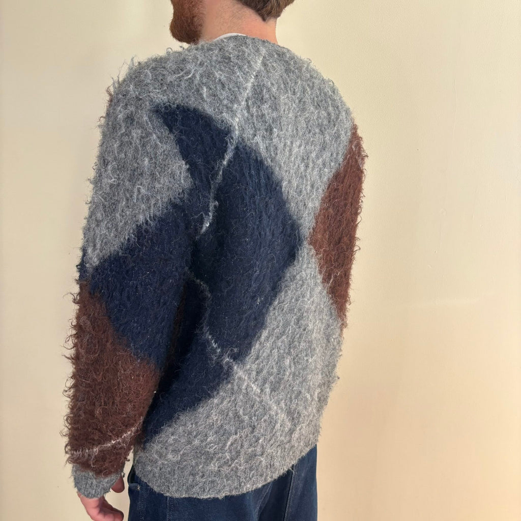 Vintage 70s knitted cardigan grey base with navy and brown oversized argyle pattern.